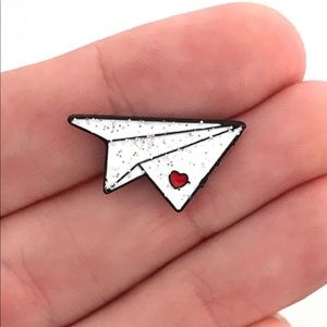 Paper plane pin